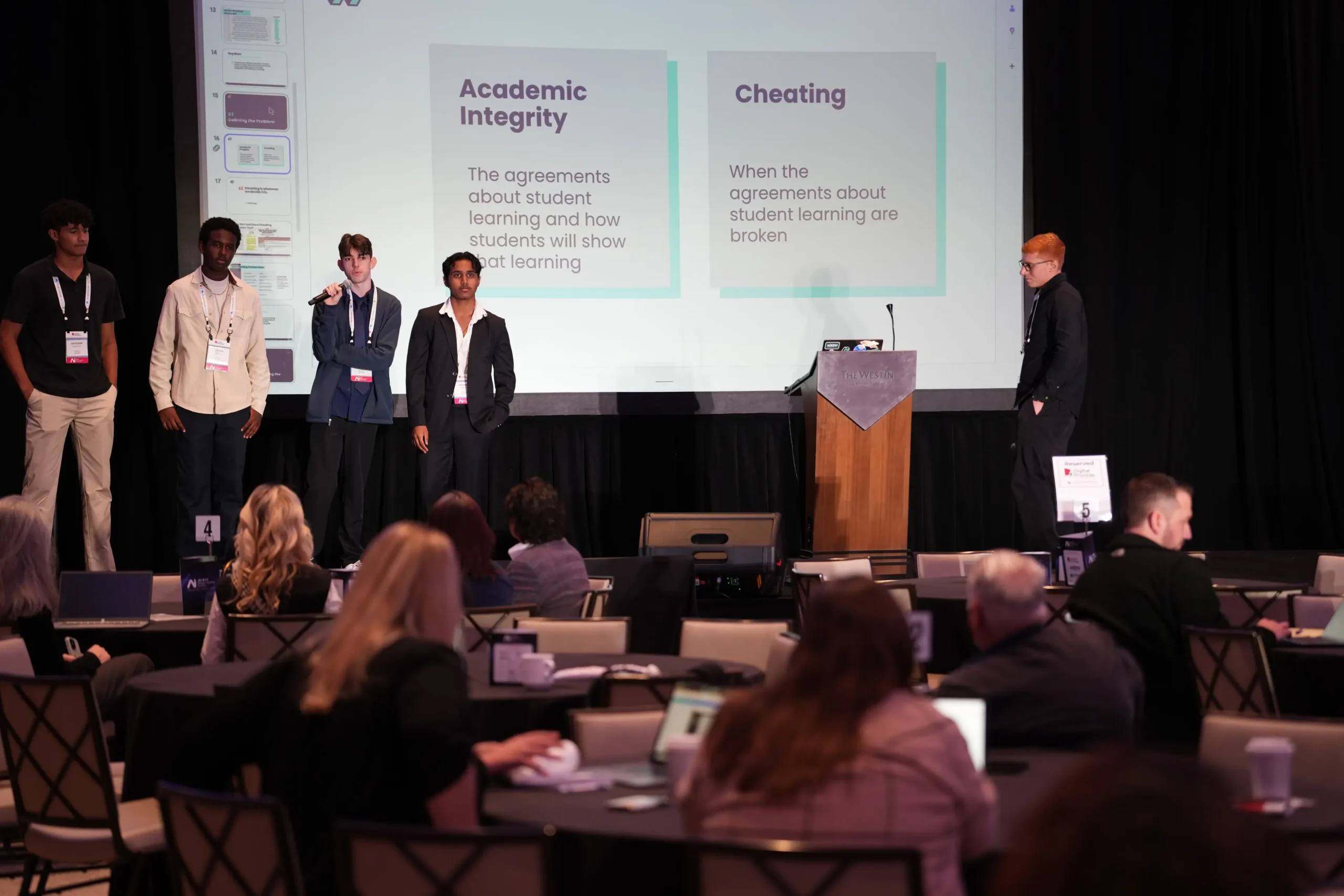 Students give a presentation on the ethics of AI at last year's Student and Community Voice AI Summit.