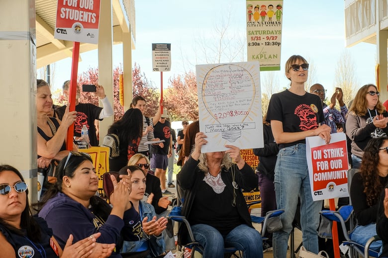 Teachers and parents lead a rally at North Natomas Regional Park on March 10, 2026. The rally marked the first day of Natomas teachers going on strike for better pay and smaller class sizes. Ruth Finch/CapRadio