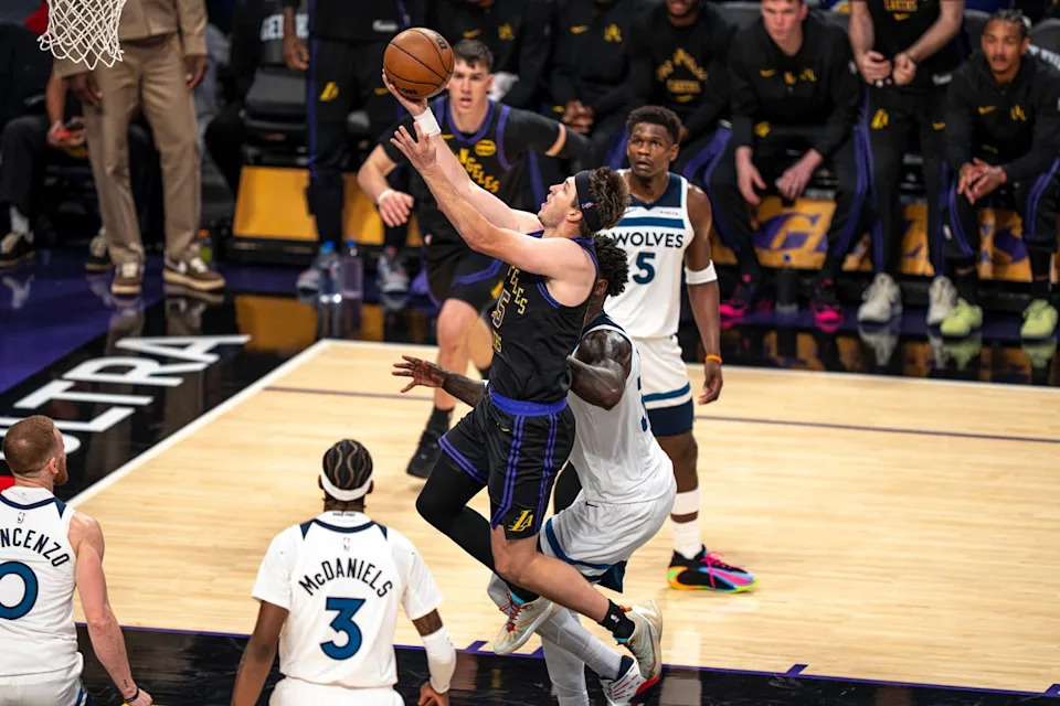 Los Angeles Lakers guard Austin Reaves (15) successfully shooting a layup during an NBA basketball game against the Minnesota Timberwolves on March 10th, 2026 in Los Angeles, CA.