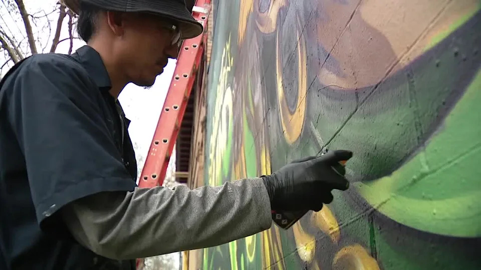 <div>Artist Steve Ha, co-founder of the Illuminaries, a local graffiti artist group, designed and painted a mural at the corner of 43rd Street and Telegraph Avenue to celebrate the Olympic gold medalist.</div>