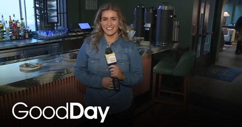 Bella is checking out the menu at Sheraton Grand Sacramento's Merchant25!