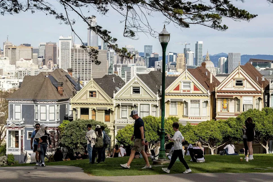 Visitors check out Alamo Square Park on Friday, an unseasonably warm winter day in San Francisco. (Stephen Lam/S.F. Chronicle)