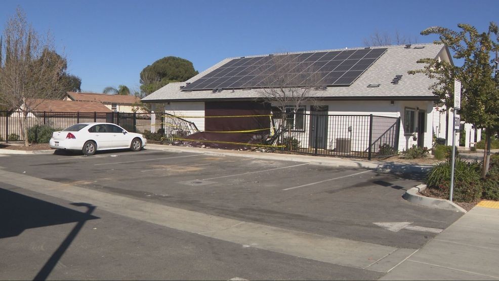 A person allegedly stole a John Deere front loader and hit an apartment building on Hughes Lane, injuring a woman inside. PHOTO: KBAK/KBFX