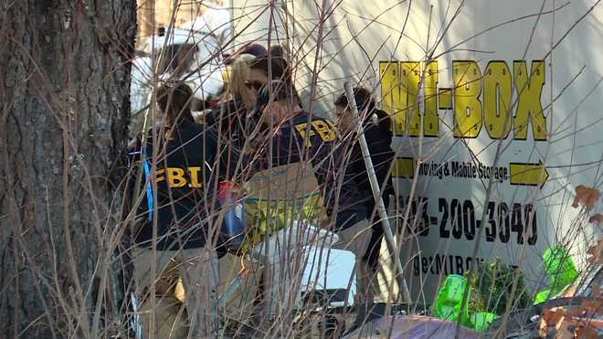 FBI agents sifted through boxes at a property on Main Street in Waterboro, Maine, on March 4, 2026.
