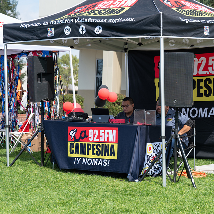 booth with a DJ to provide music for the Financial Aid fest