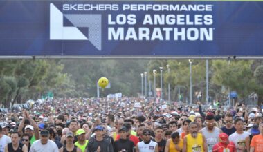 Los Angeles Marathon awarding medals to runners who complete 18 miles