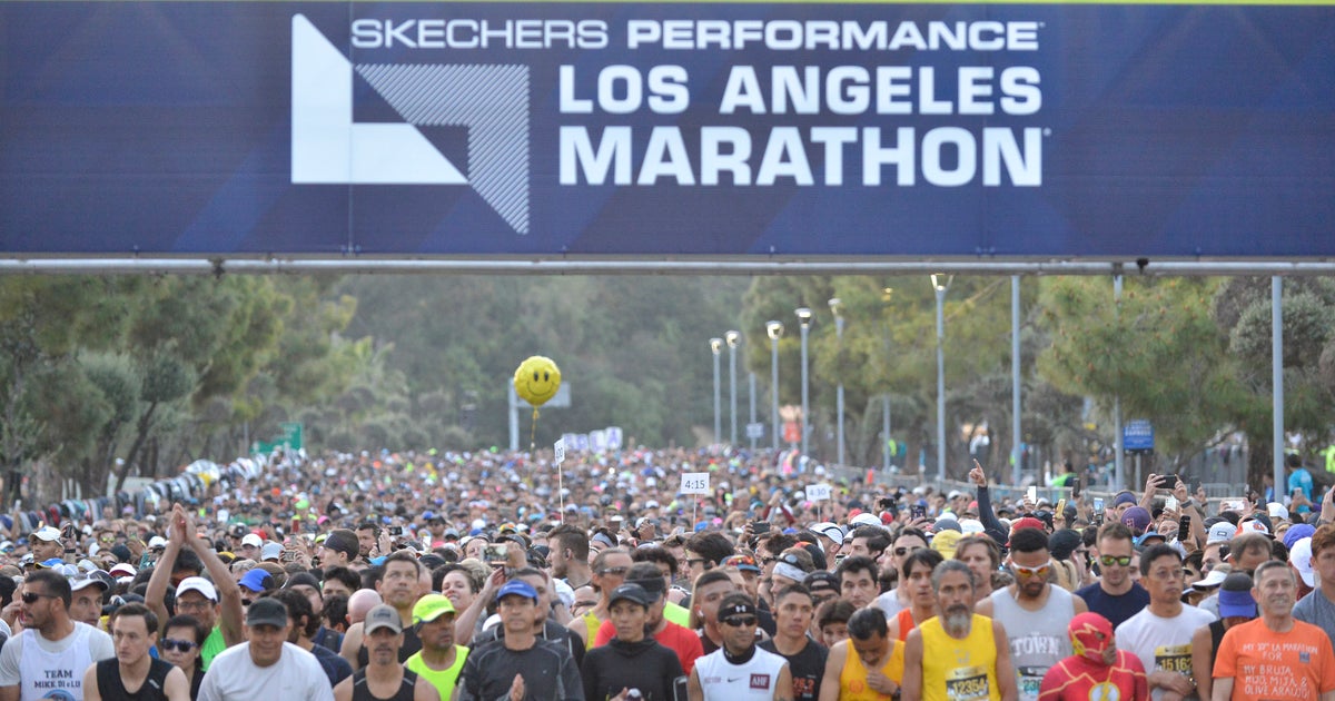 Los Angeles Marathon awarding medals to runners who complete 18 miles