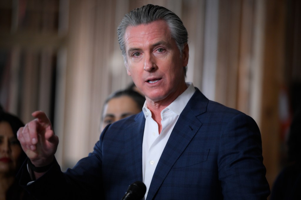Governor Gavin Newsom speaking at a press conference in Hayward, California.