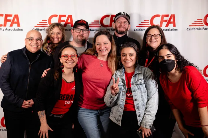 A group of people pose for picture