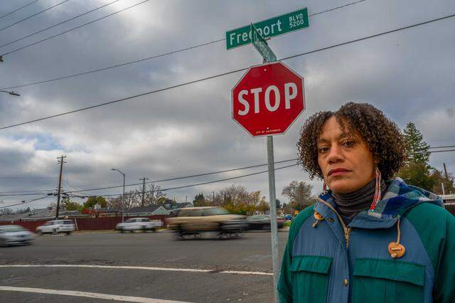 Kiara Reed, executive director of Civic Thread, stands on the corner of Freeport Boulevard at Oregon Drive in Sacramento on Dec. 18, 2024. Sacramento’s plan to redesign Freeport Boulevard for pedestrian safety scored 92 out of 100 points in the 2024 Active Transportation Program cycle but did not receive funding after the state slashed hundreds of millions of dollars from the grant program.