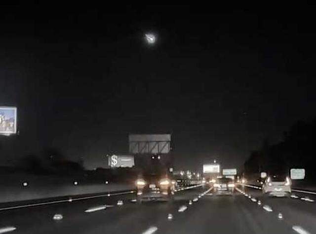 A meteor is seen streaking across the sky from a dashcam in a vehicle driving on the Bayshore Freeway section of Highway 101 near Palo Alto on Sunday, March 22, 2026.