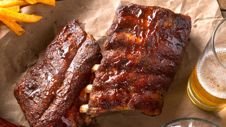 Overhead of view of ribs with glass of beer