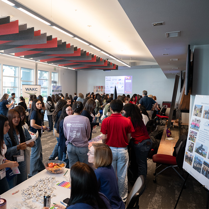several event participants gathered in a room for a workshop