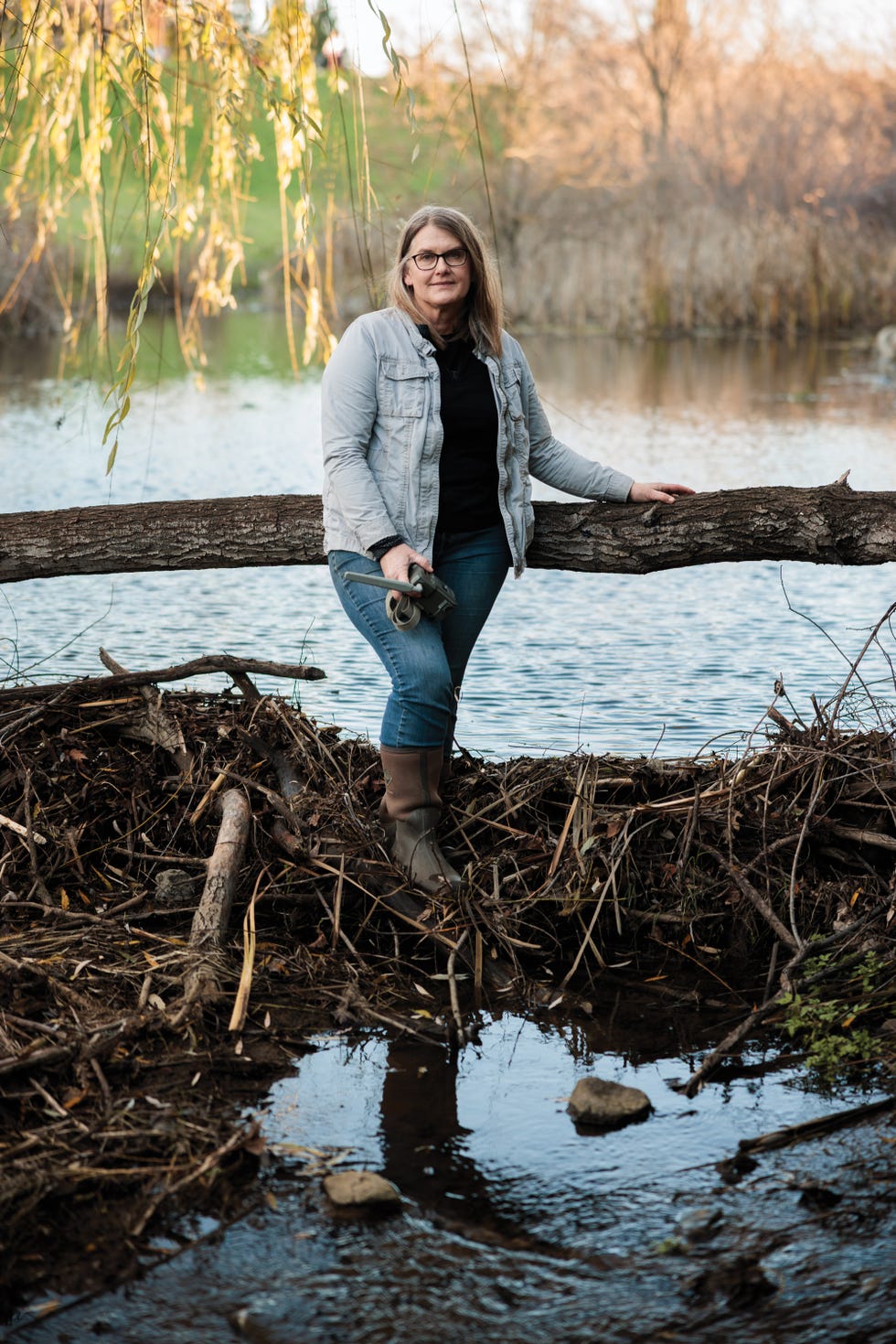 beavers, cathy mueller, a biologist and beavercorps graduate, at a dam in a subdivision in el dorado hills, near sacramento