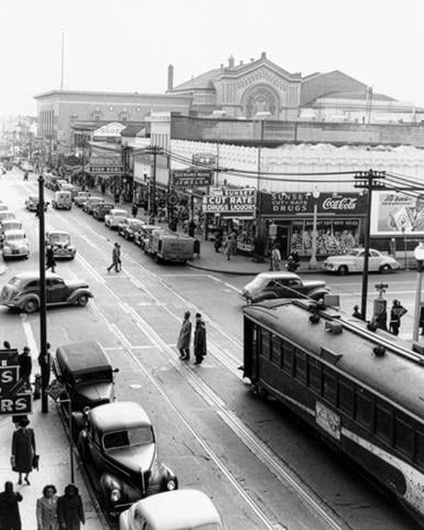 once known as the harlem of the west, the fillmore district was 60 percent black, the intersection of fillmore and post shows the thriving community in 1947