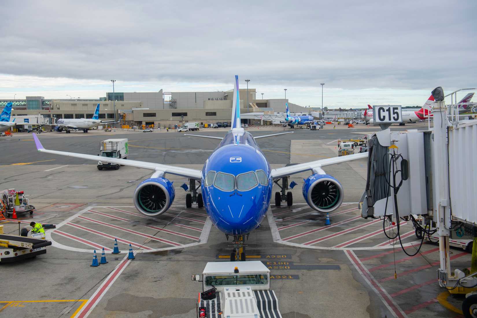 JetBlue Airbus 220-300 with Mint Hops livery at the gate on Boston Logan International Airport, Boston, Massachusetts.