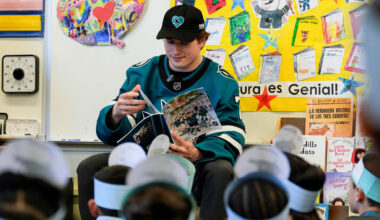 Sharks visit local elementary school, read to students