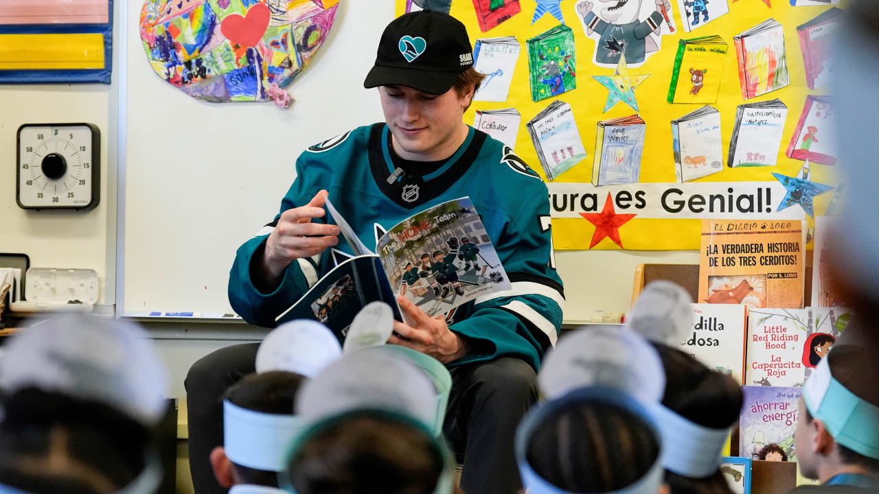 Sharks visit local elementary school, read to students
