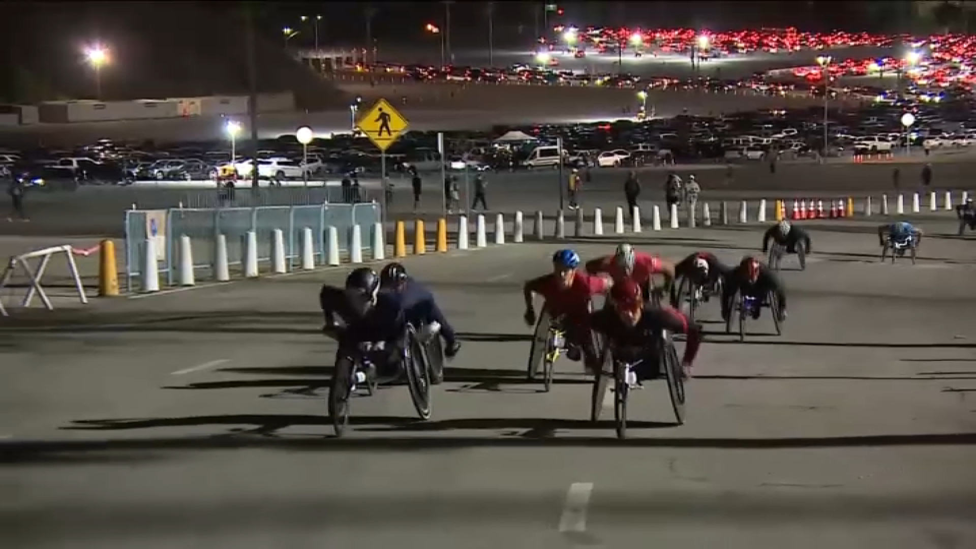 Athletes in wheelchairs race off at the beginning of the course at Dodger Stadium.
