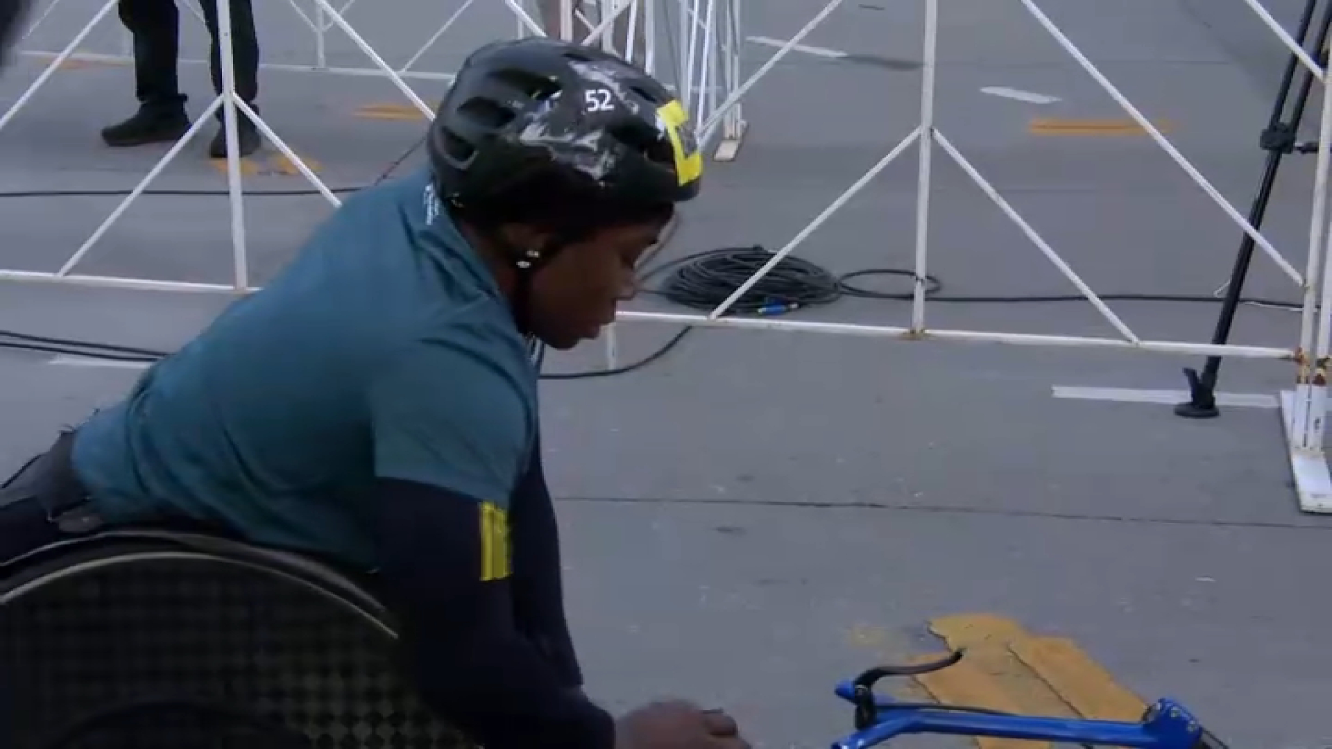 Hannah Babalola claims victory in the women’s wheelchair race with a time of 2:17:48.86.