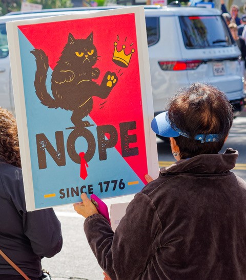 The "No Kings" protest March 28 in La Jolla was one of at least 20 planned around San Diego County and more than 3,200 across the nation. (Tom Stuart)