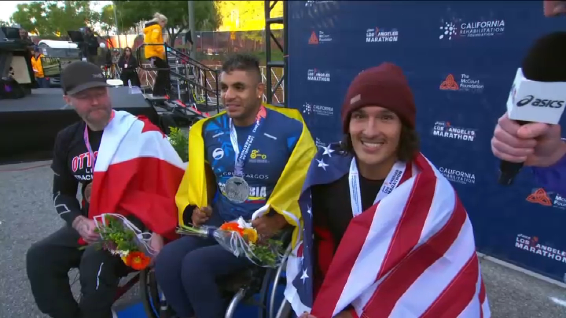 Joshua Cassidy, Luis Franco Sanclemente and Miguel Jiminez Vergara are all smiles after achieving the top three spots on the podium for the men’s wheelchair finish.