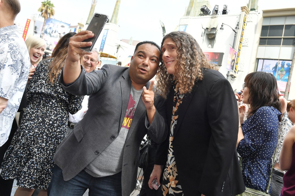 Jose Luis Solache takes a selfie with Weird Al Yankovic.