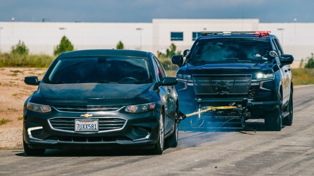A Riverside County Sheriff's patrol car deploys its Grappler net to stop a car.