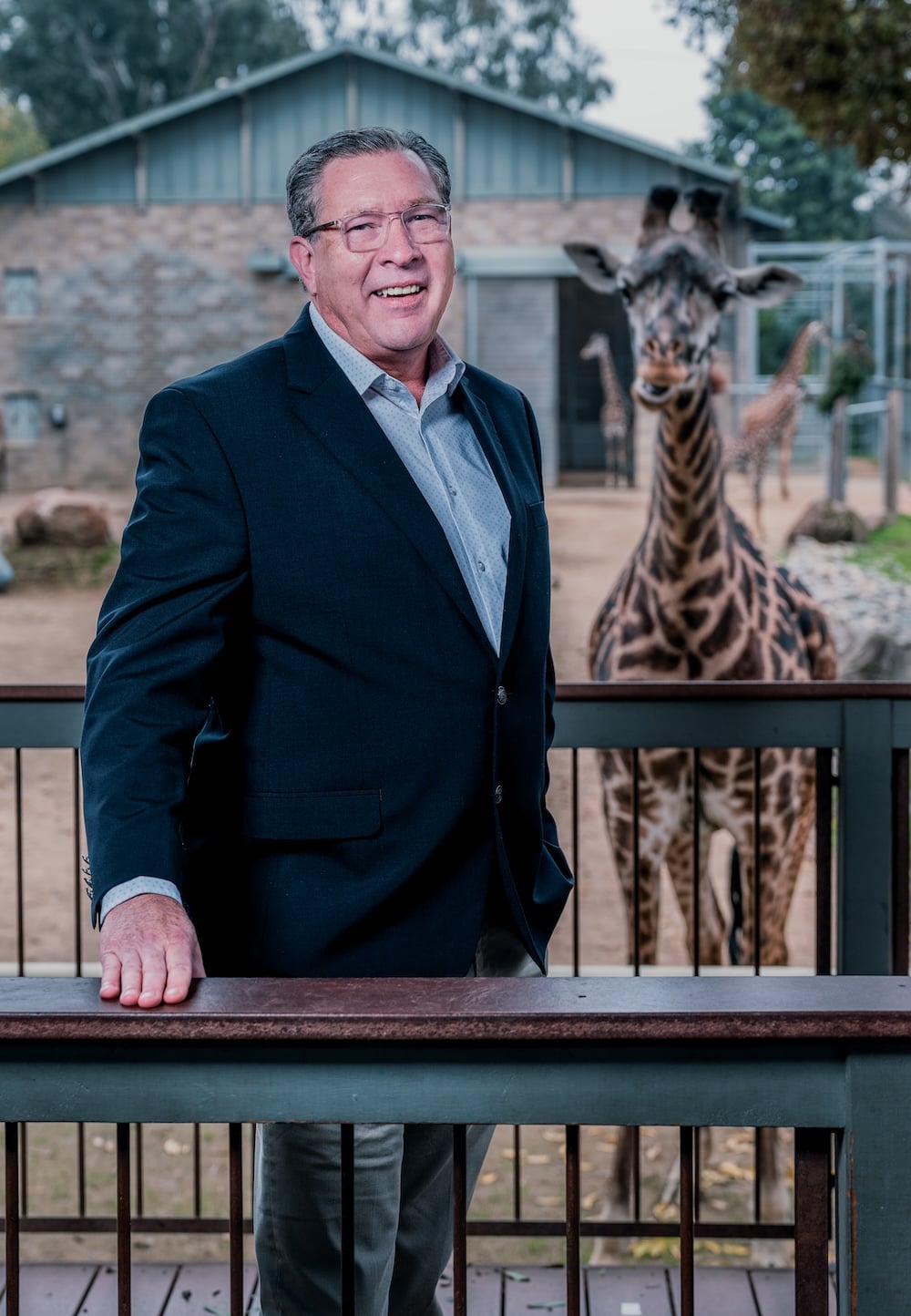 Dan Simon, the new director of the Sacramento Zoo, poses for a portrait at Giraffe Viewing Deck