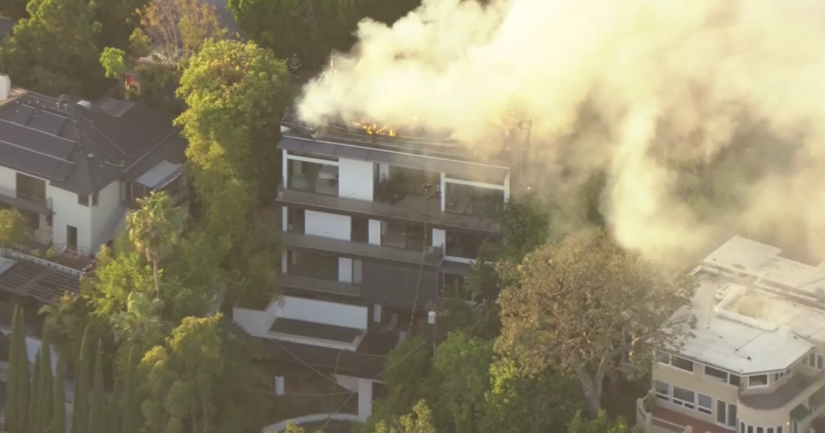 Los Angeles firefighters extinguish large fire at Hollywood Hills home