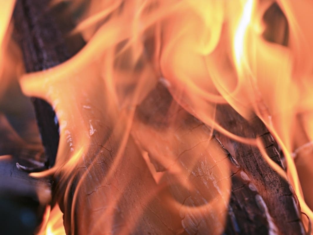 Raging Orange County House Fire Injures Woman, Threatens Homes