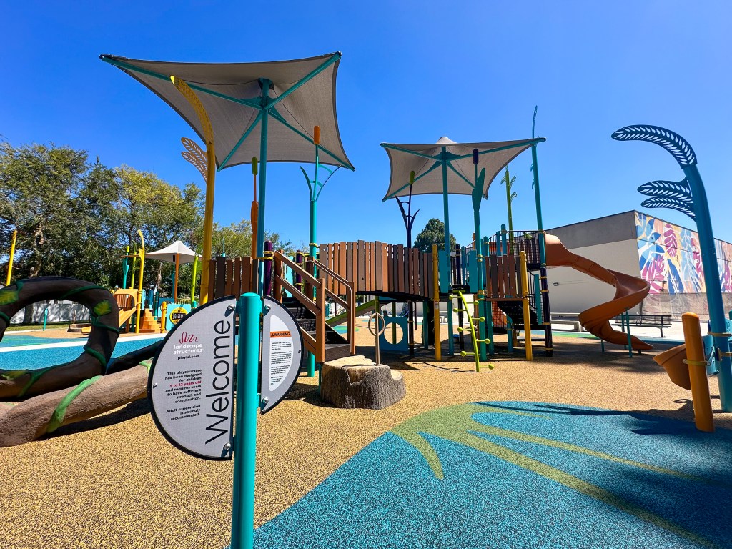 The new Silverado Park Signature Playground's design reflects the vibrant colors and theme of Silverado Park's mural, "We are the Seeds" by Mer Young. (Courtesy of the City of Long Beach).
