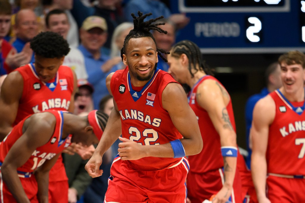 Kansas guard Darryn Peterson smiling after a dunk.