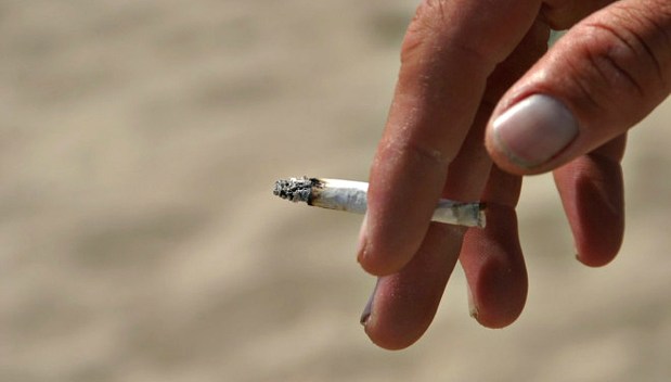 A person holds a cigarette in this file photo. 