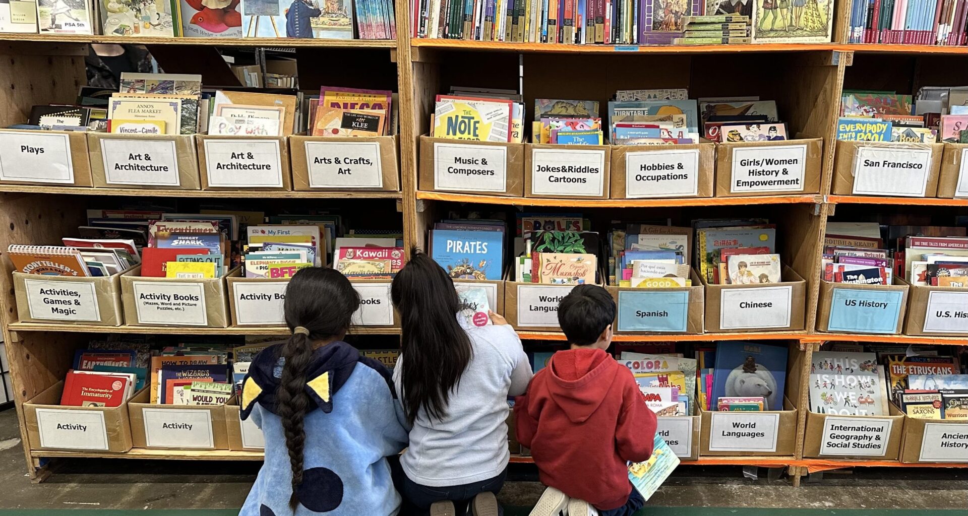 In a Bayview warehouse, kids scour shelves for 5 free books