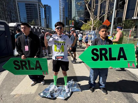 Signs direct Students Run Los Angeles participants at the LA Marathon on Sunday, March 8. Photo: Michelle Edgar 