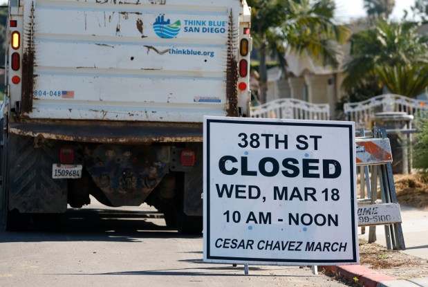 A traffic sign is displayed for a Cesar Chavez march near Cesar Chavez Elementary School on March 18, 2026, in San Diego.  (K.C. Alfred / The San Diego Union-Tribune)