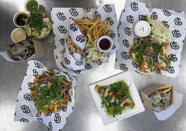 A selection of dishes by Michelin-starred chef Drew Deckman being served this season at Draft by Ballast Point in Section 107 at Petco Park. (Drew Deckman)