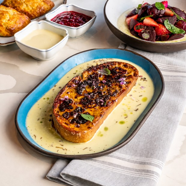 Truffle French toast with condensed milk Anglaise is an add-on item on the Easter brunch menu at Kingfisher restaurant in San Diego's Golden Hill. (Michael Ly)
