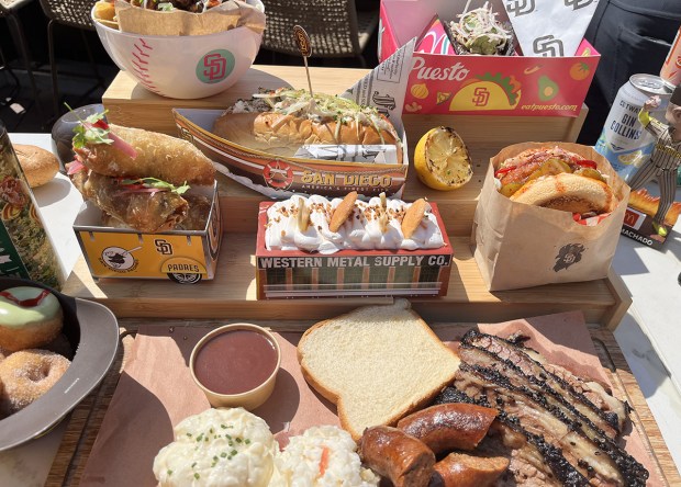 A smorgasboard of Petco Park food items displayed at the media preview on Tuesday. (Pam Kragen / The San Diego Union-Tribune)
