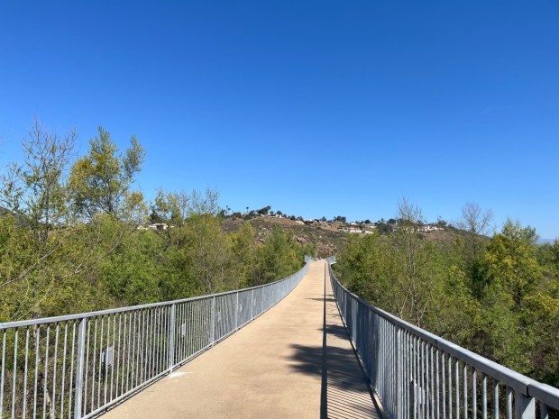 Hikers cross over the San Dieguito River to reach the Coast to Crest Trail. (Maura Fox / The San Diego Union-Tribune)