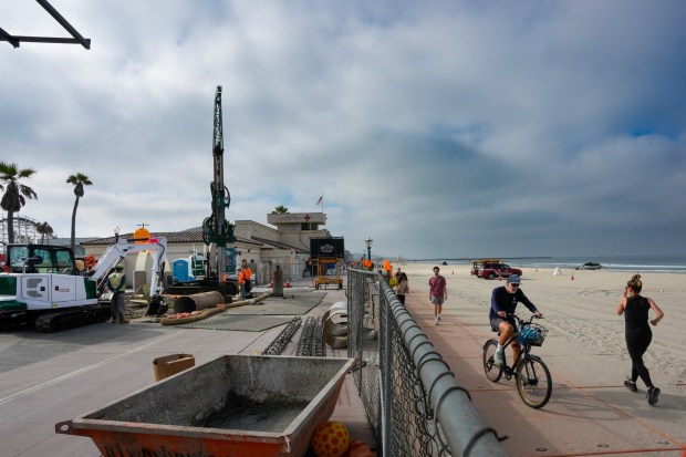 Construction for the temporary lifeguard tower has begun just north of the old existing tower in Mission Beach on Wednesday, March 25, 2026, in San Diego, CA. In place during the construction is a detour towards a platform boardwalk that goes around the construction. (Nelvin C. Cepeda / The San Diego Union-Tribune)