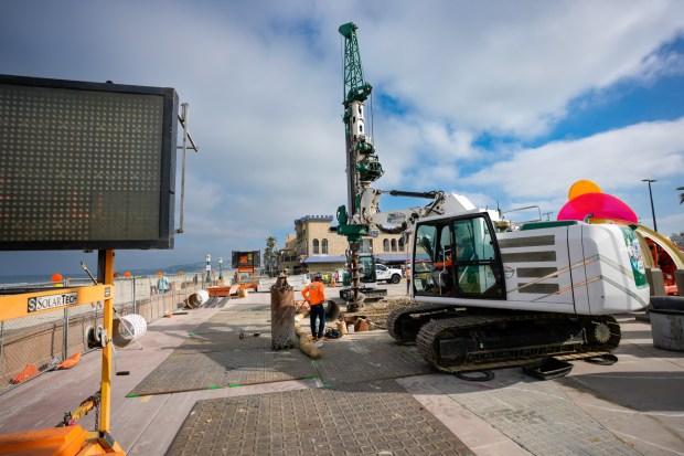 Construction for the temporary lifeguard tower has begun just north of the old existing tower in Mission Beach. (Nelvin C. Cepeda / The San Diego Union-Tribune)