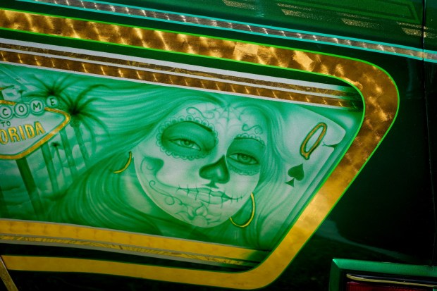 A mural that appears on one of the fender panels of one of the lowriders on display for the unveiling ceremony held at the Logan Heights Library in San Diego on Friday, March 13, 2026.  (Nelvin C. Cepeda / The San Diego Union-Tribune)