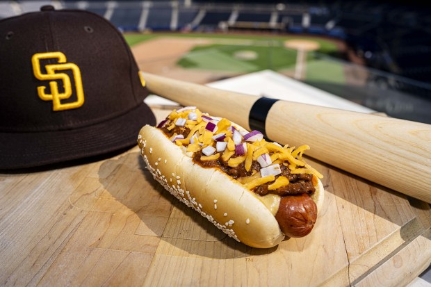 This chili cheese dog, topped with beef short rib chili, is one of the new food items that will be offered at Petco Park for the San Diego Padres' 2026 season. (Armond Feffer / San Diego Padres)