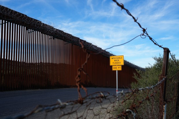 Public access ends at the barbed wire fence a few feet south of the trail's terminus monument, photographed here on Feb. 24, 2026. (Nelvin C. Cepeda / The San Diego Union-Tribune)