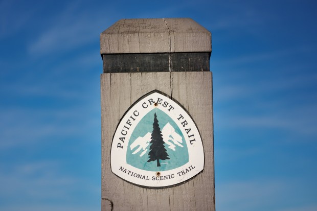 The trailhead marker that marks the start of the Pacific Crest Trail at the southern terminus, located just north of the wall along the U.S.-Mexico border in Campo. (Nelvin C. Cepeda / The San Diego Union-Tribune)