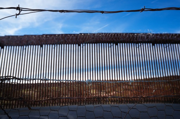 A stretch of land along the border wall within the United States is now within a designated National Defense Area. (Nelvin C. Cepeda / The San Diego Union-Tribune)