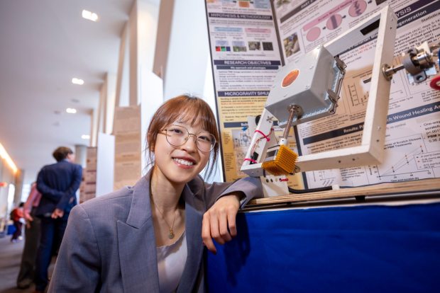 Leanne Fan poses with her project at the Regeneron Science Talent Search in Washington, D.C., on Sunday, March 8, 2026. (Chris Ayers Photography/License by Society for Science)