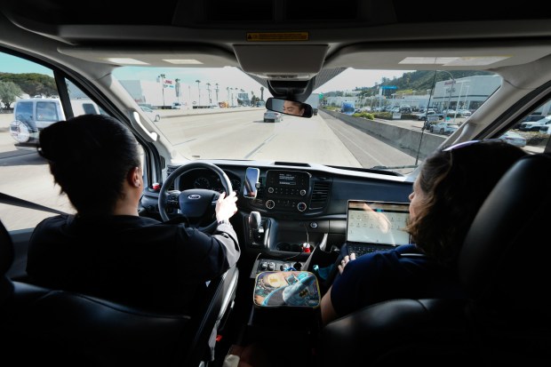 Working on a tip, Lisa Silvestro (r), 52, a nurse practitioner, and Prizma Mercado (l) head to an encampment along Int. 805 to check in on one of their patients who is due for her 2nd pre-exposure prophylaxis (PREP) treatment. Silvestro and Mercado are health professionals with Healthcare in Action and offer medical care to those who have become homeless. (Nelvin C. Cepeda / The San Diego Union-Tribune)